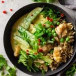 Chicken Thai Green Curry served over brown rice in a grey bowl.