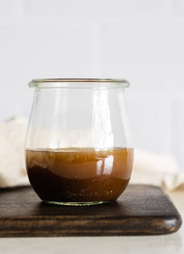 Maple Mustard Balsamic Dressing in a glass jar.