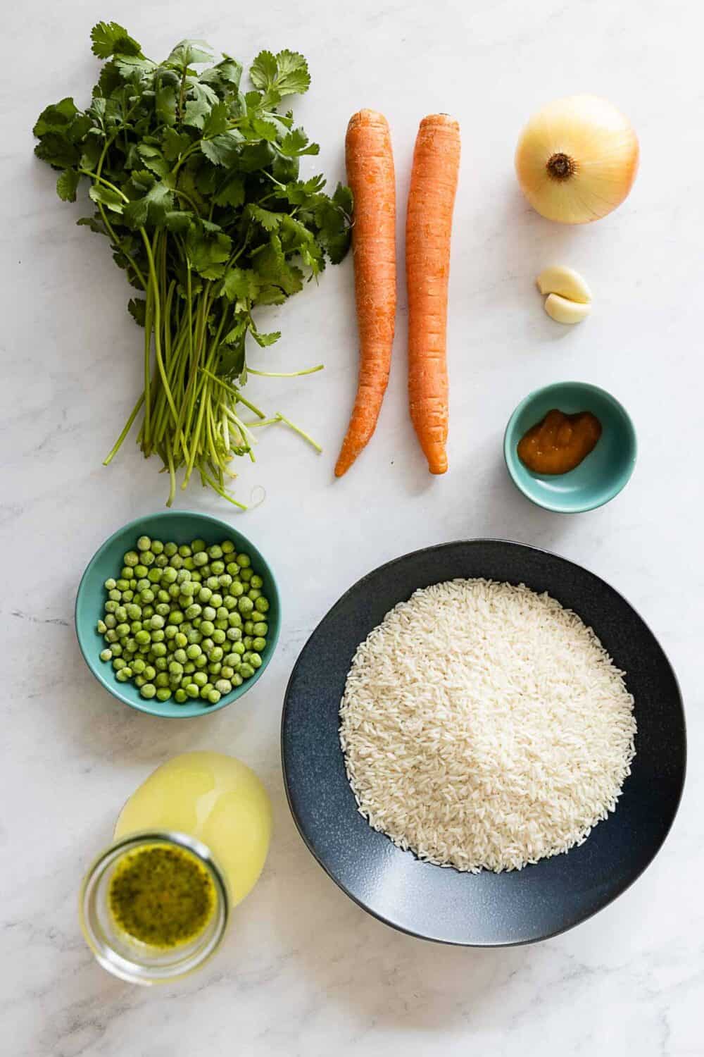 All ingredients for Peruvian Green Rice laid out on a kitchen counter.