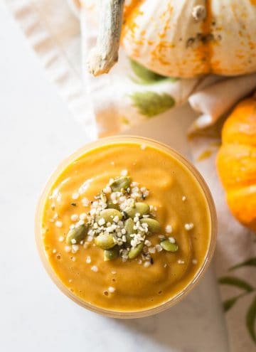 top down view of pumpkin smoothie topped with seeds