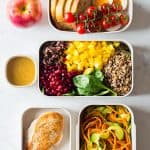 Several meal prep containers showcasing the food for the full clean eating meal plan