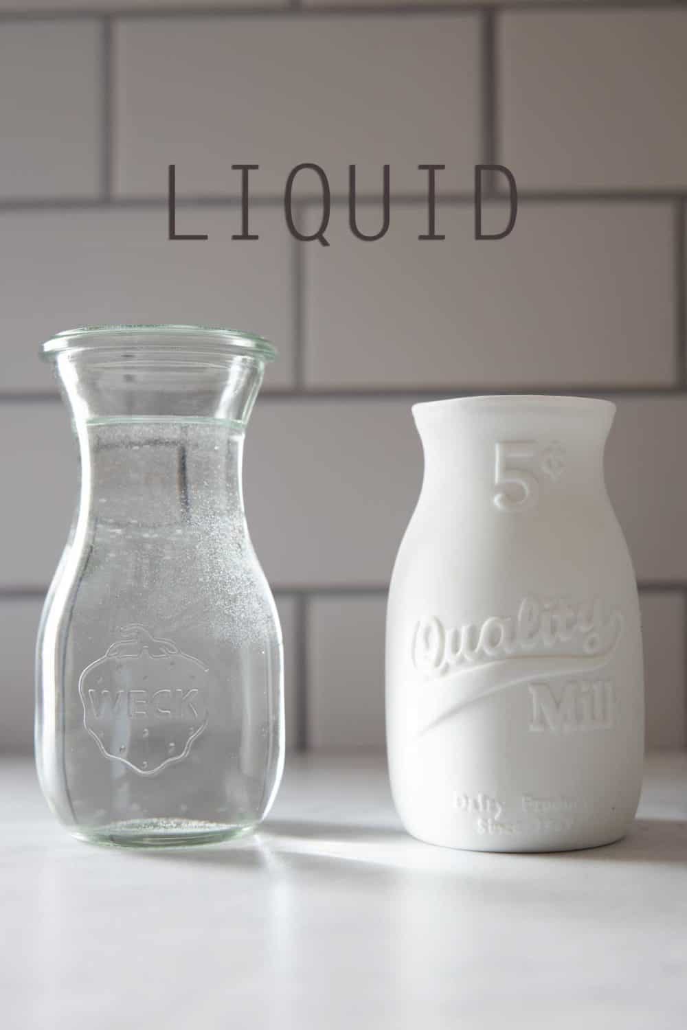 Jar with water and jar with milk as example for best liquid for breakfast smoothies.