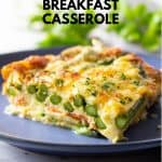 Piece of low carb breakfast casserole with asparagus and melted cheese on a blue plate