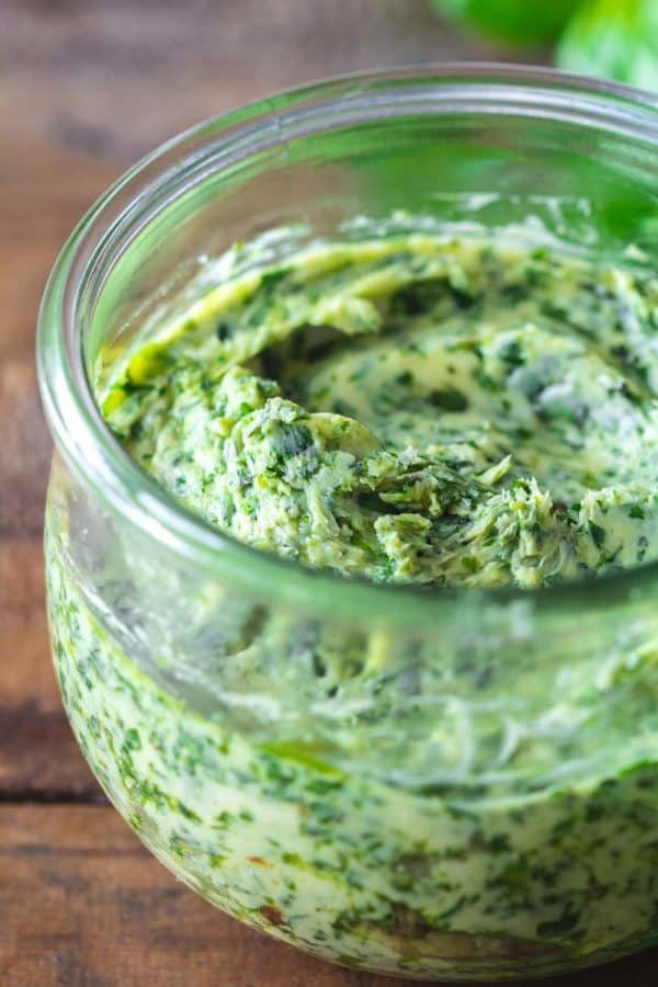 Garlic herb butter is a delicious compound butter made with fresh herbs and roasted garlic. This homemade condiment recipe makes the perfect topping for baked or mashed potatoes, garlic bread, or pasta. roasted garlic herb butter in a jar