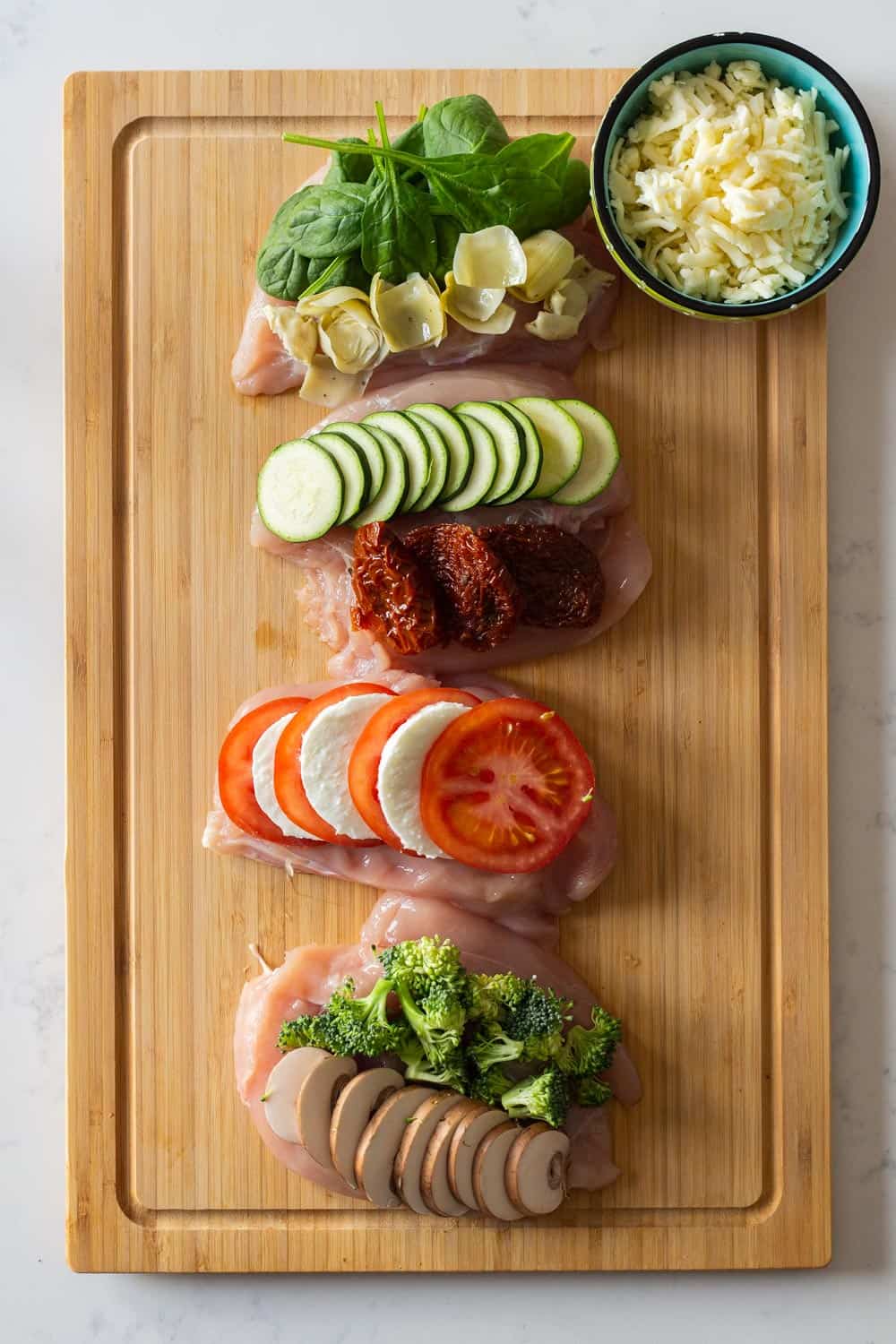 Raw Stuffed Chicken Breast on a cutting board