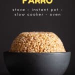Raw Farro in a golden Measuring Cup