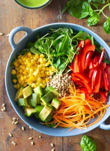 Summer Salad Ingredients in a blue salad bowl.