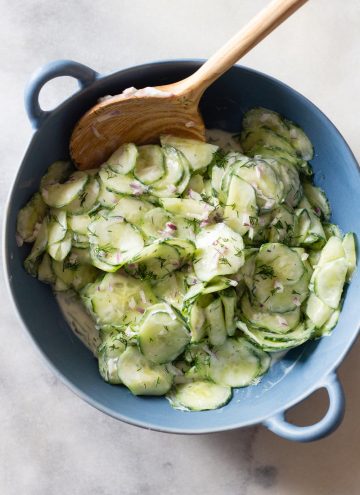 Creamy Cucumber Salad in a blue salad bowl