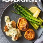 Chicken with creamy peppercorn sauce with roasted sweet potato and asparagus on a plate and text overlay for Pinterest.