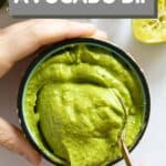 Avocado Dip in a bowl with text overlay of recipe title for Pinterest.