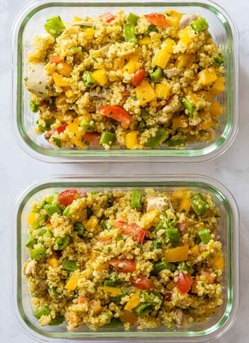 Two Chicken Quinoa Meal Prep Bowls on a kitchen counter.