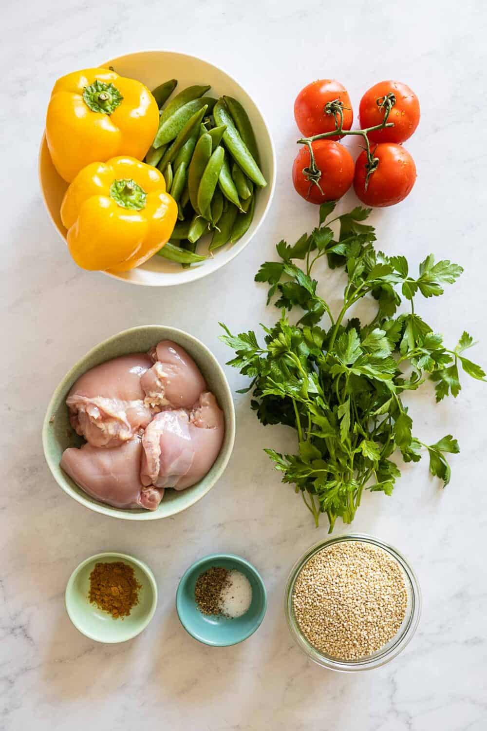 Ingredients for Chicken Quinoa Meal Prep Bowls on a kitchen counter.