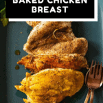 Seasoned baked chicken breast on a teal colored platter with text overlay for Pinterest.