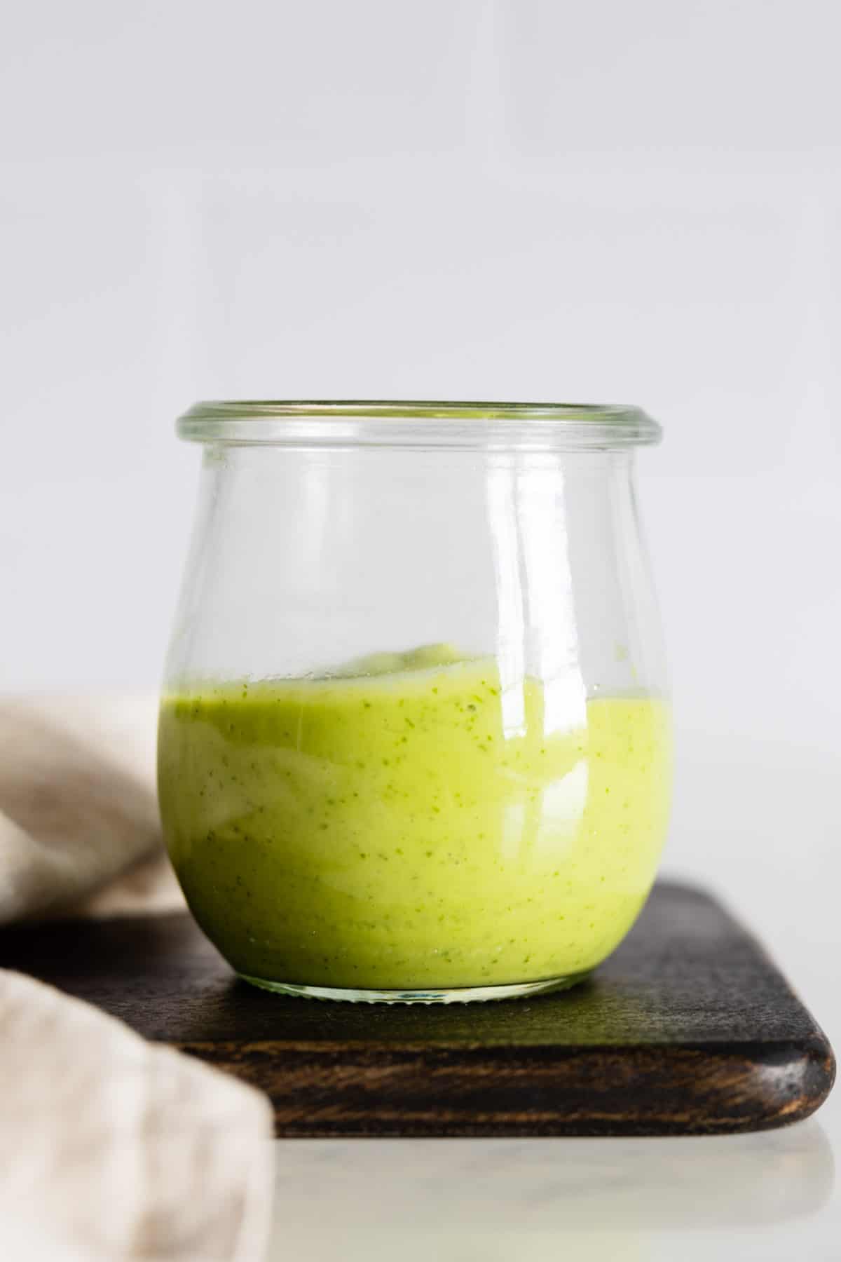 Cilantro Lime Avocado Dressing in a glass jar.