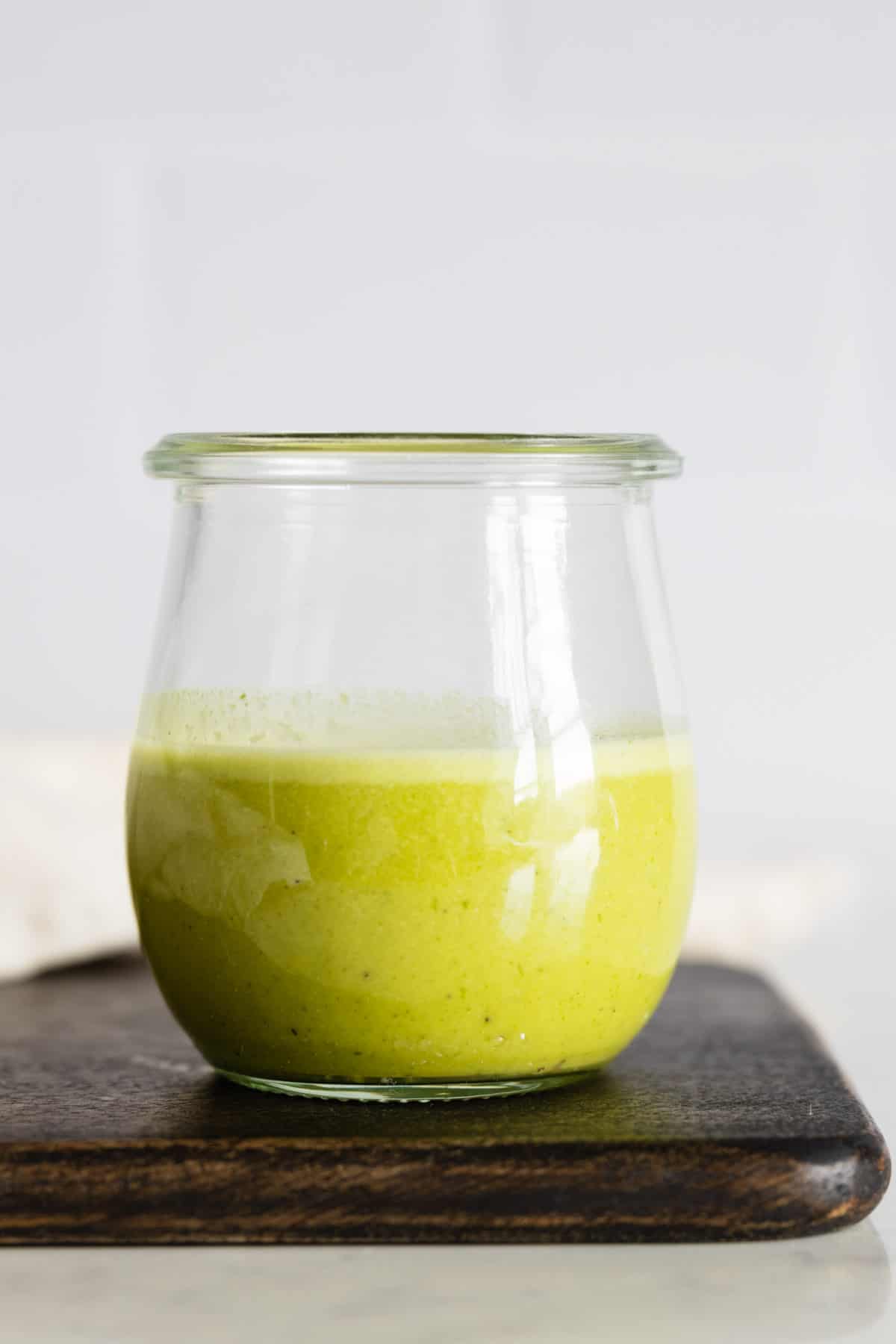 Citrus Basil Dressing in a glass jar.