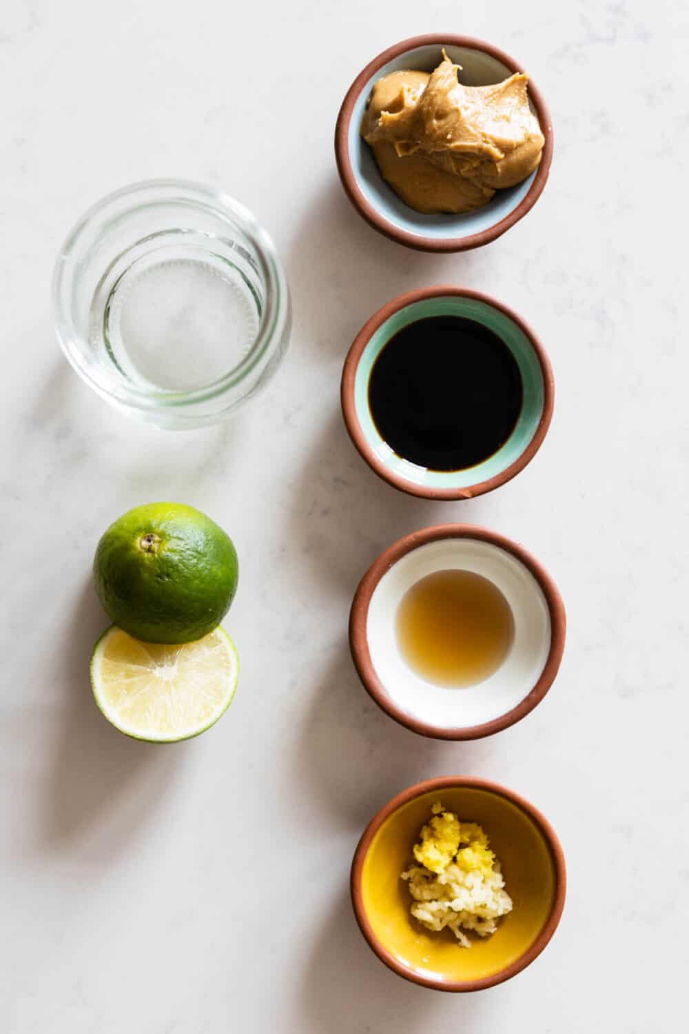 Ingredients for Peanut Salad Dressing laid out on a kitchen counter.