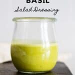 Glass jar with green salad dressing with title reading: Citrus Basil Salad Dressing.