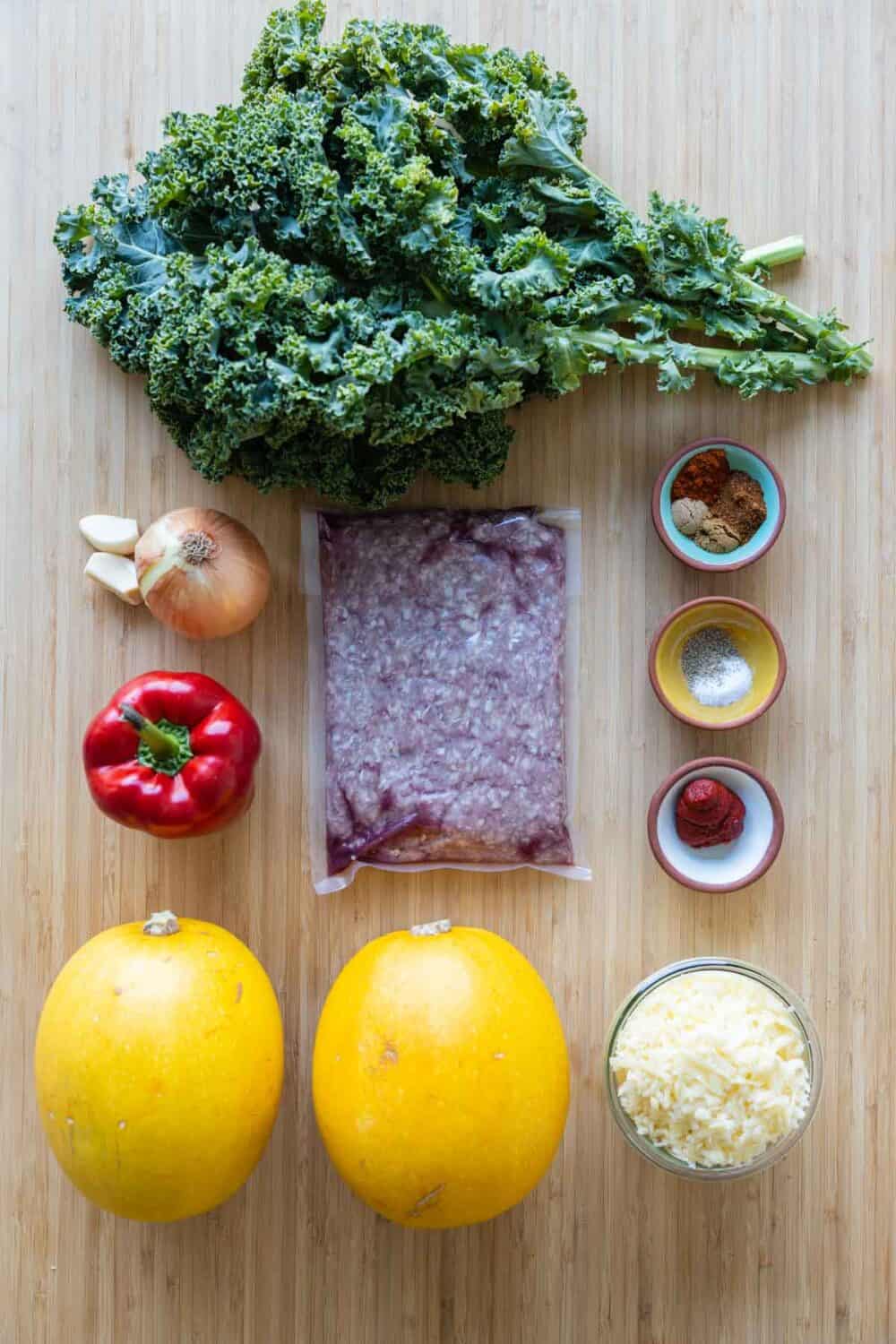 Ingredients for stuffed spaghetti squash laid out on a table.