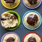 6 muffins with chocolate on top in colorful silicone muffin liners.