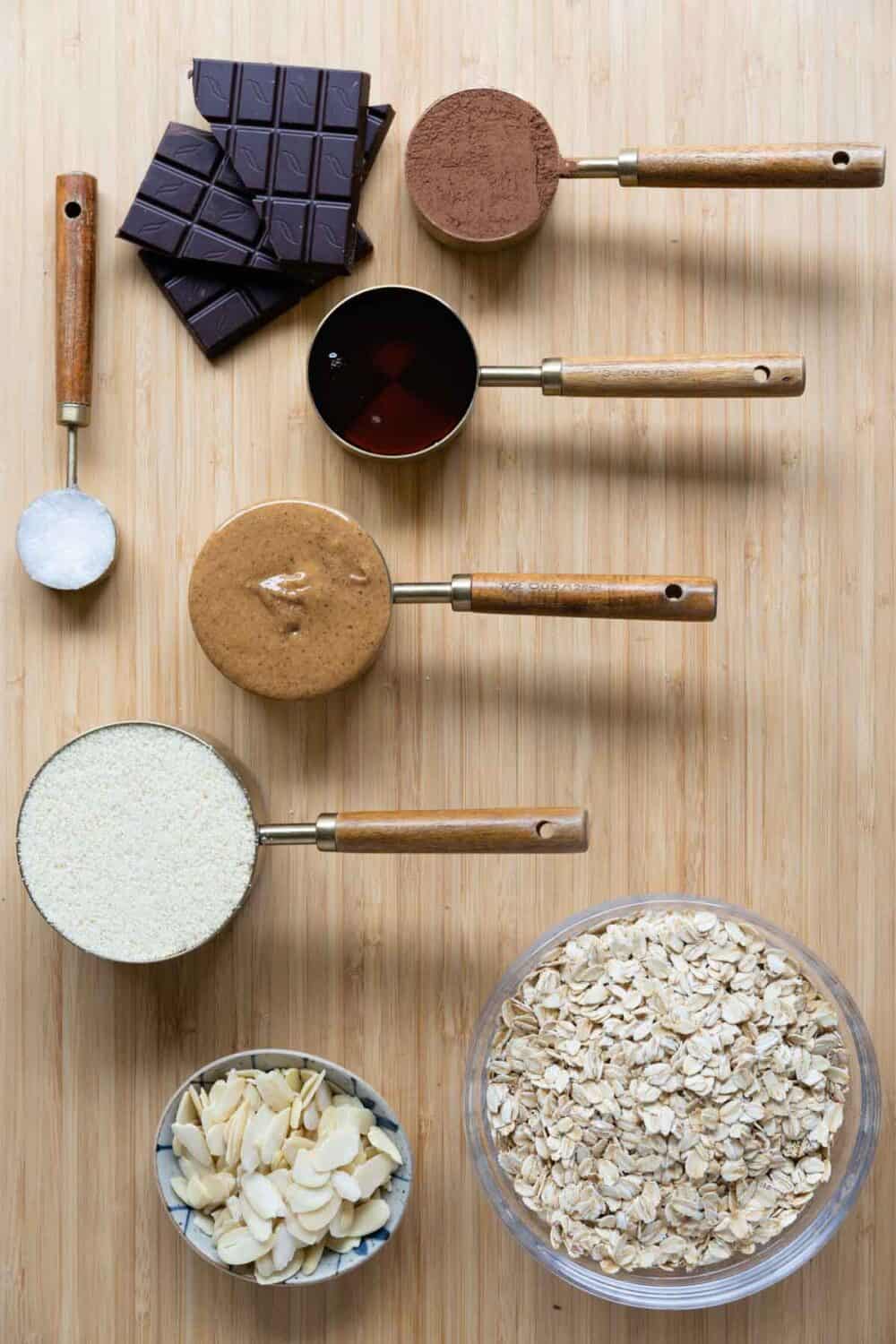 Ingredients for almond granola bars laid out on a kitchen counter.
