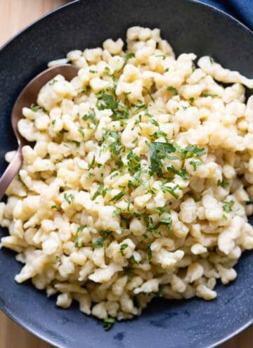 German Spaetzle served in a blue bowl.