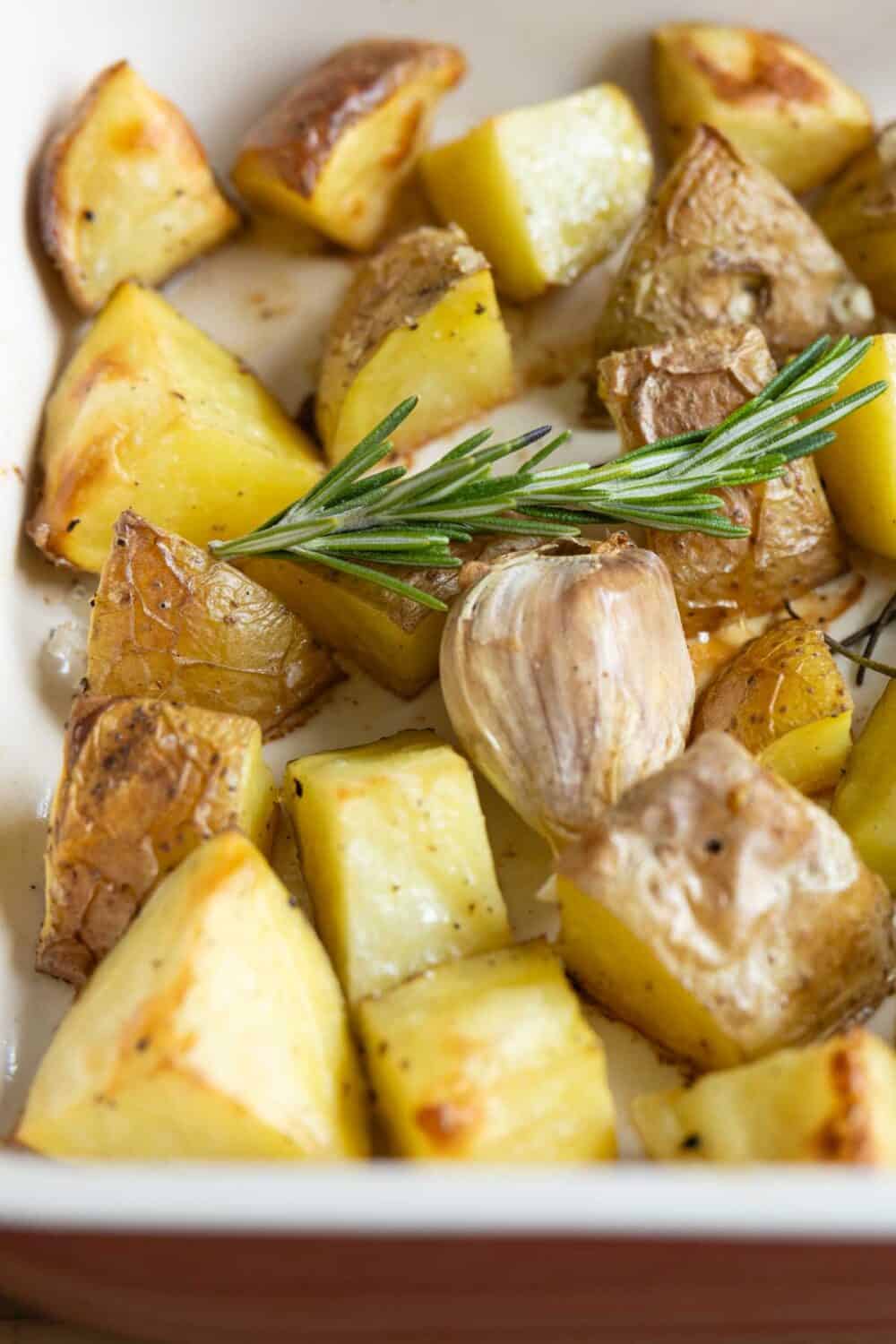 Close-up image of texture and color of garlic roasted potatoes.