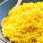 Yellow Rice in a blue bowl.