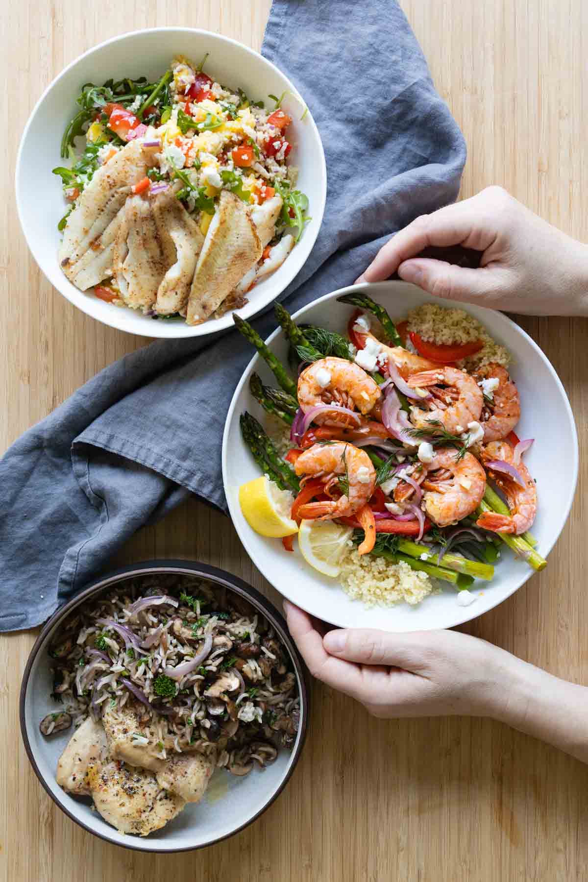 Three serving bowls filled each with a different 30-minute dinner recipe.